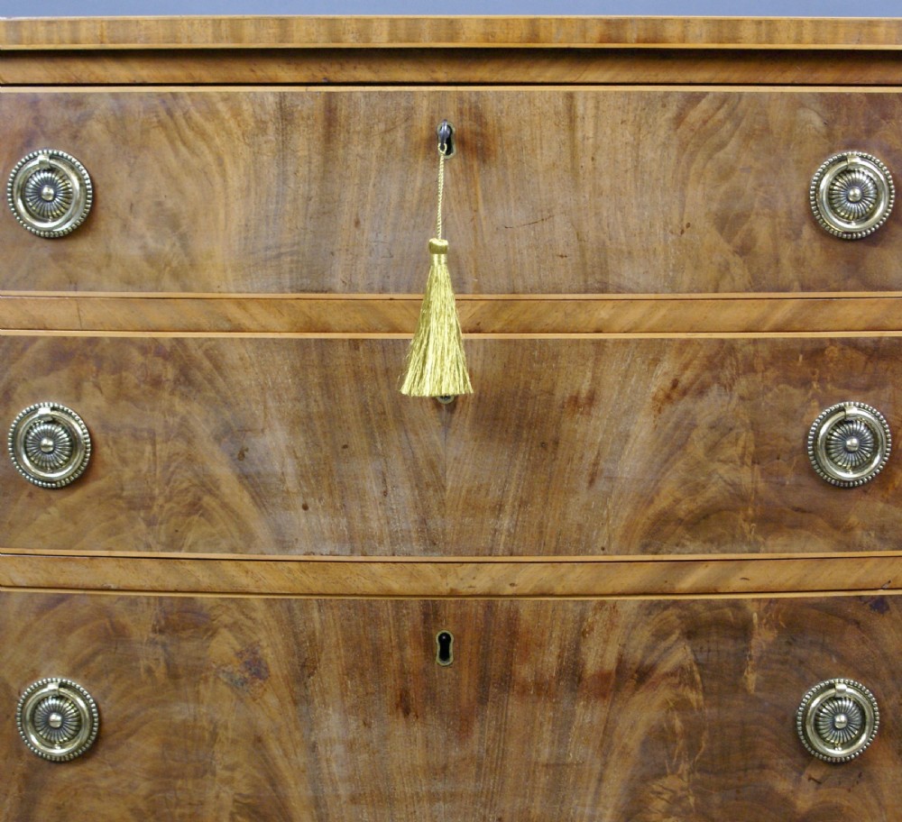 A George III Flame Mahogany Bow Fronted Chest View IV