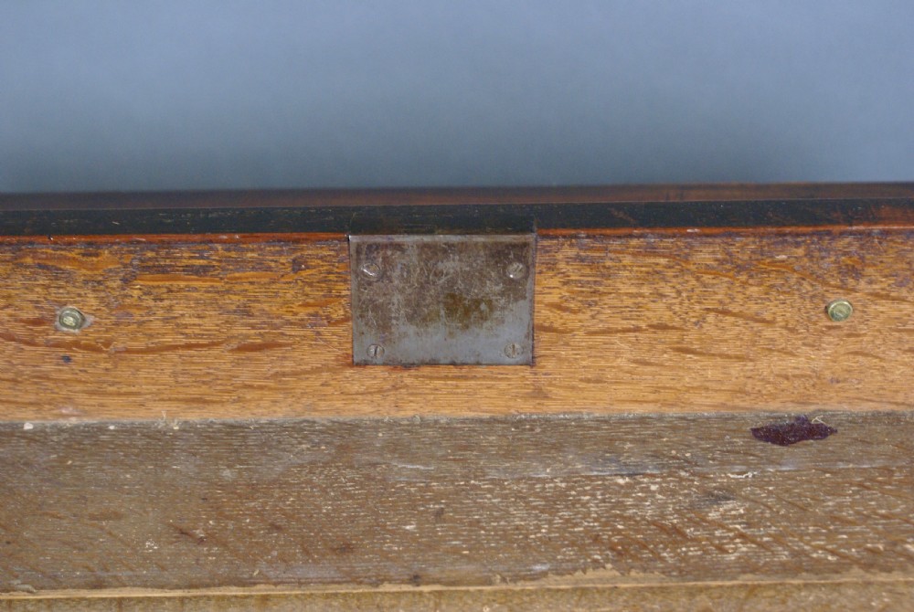 A George III mahogany chest of drawers featuring four graduated drawers, brass swan-neck handles, a pull-out brushing slide, and bracket feet. View VII