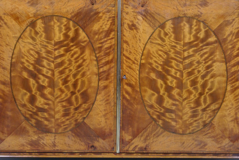 A highly decorative 19thC satinwood side cabinet View III