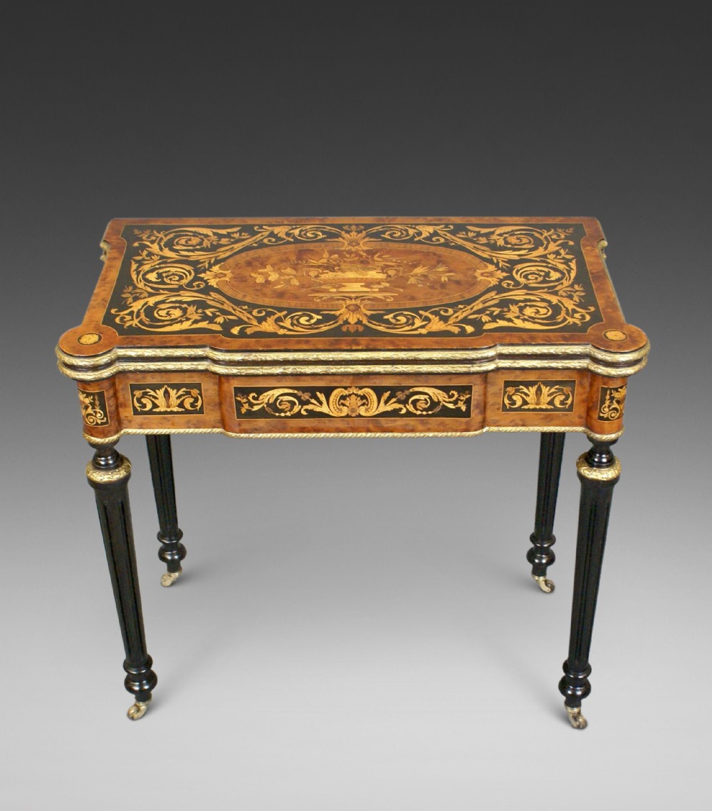 An Attractive Inlaid And Ormolu Mounted Card Table