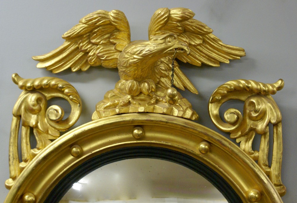 A Regency carved & gilt convex mirror View II