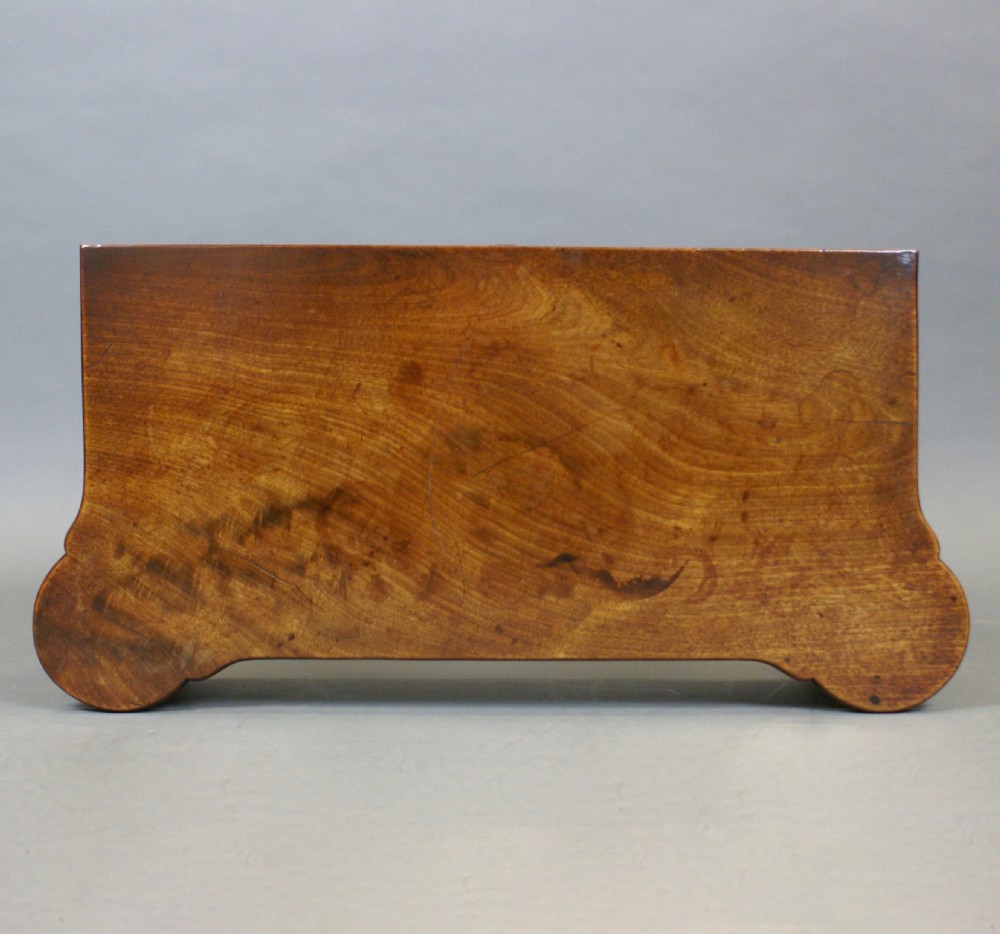 A Georgian mahogany card table featuring a foldover top with shaped corners, supported on slender cabriole legs with pad feet. View II