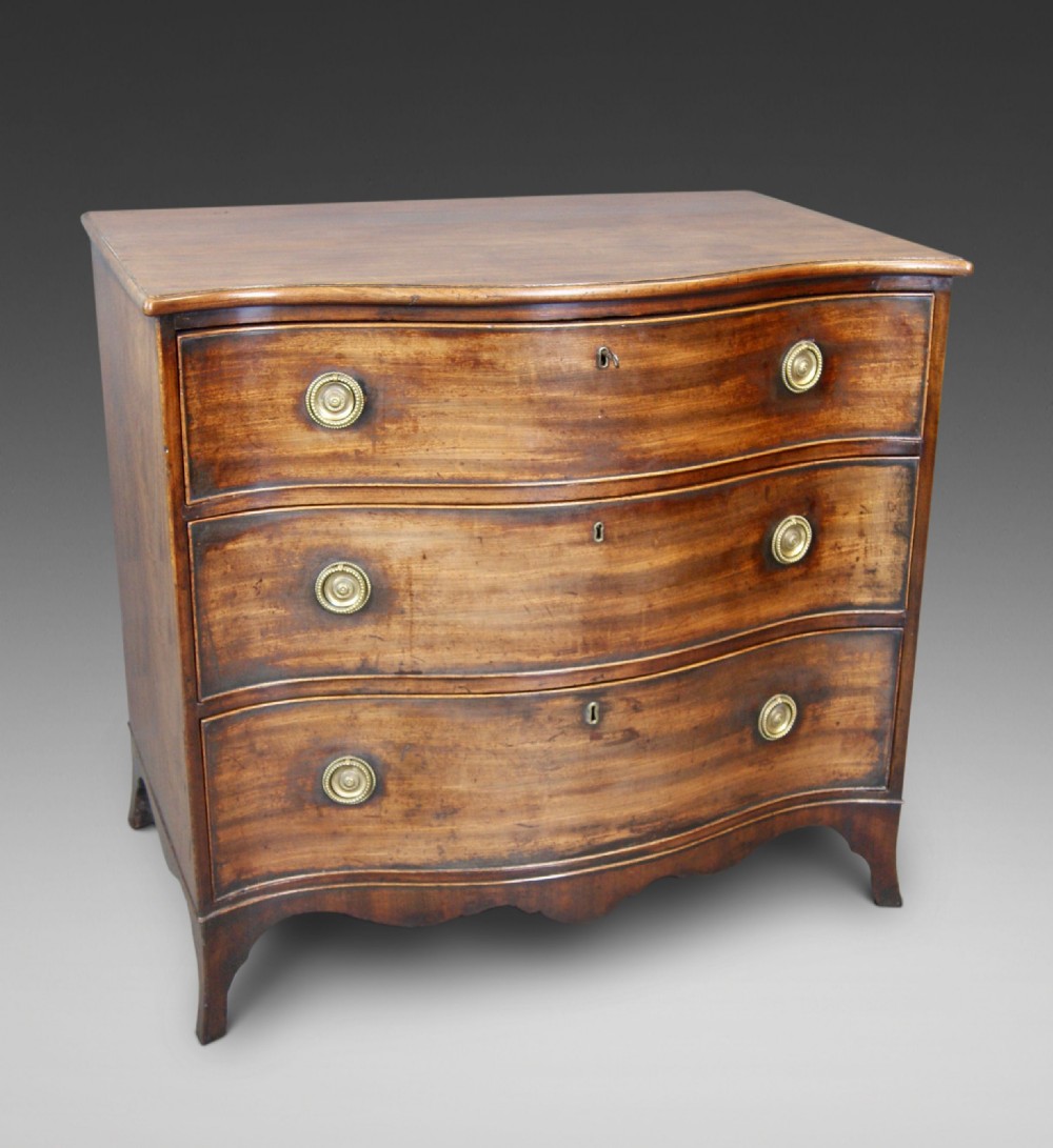 A Hepplewhite Period Mahogany Serpentine Chest 