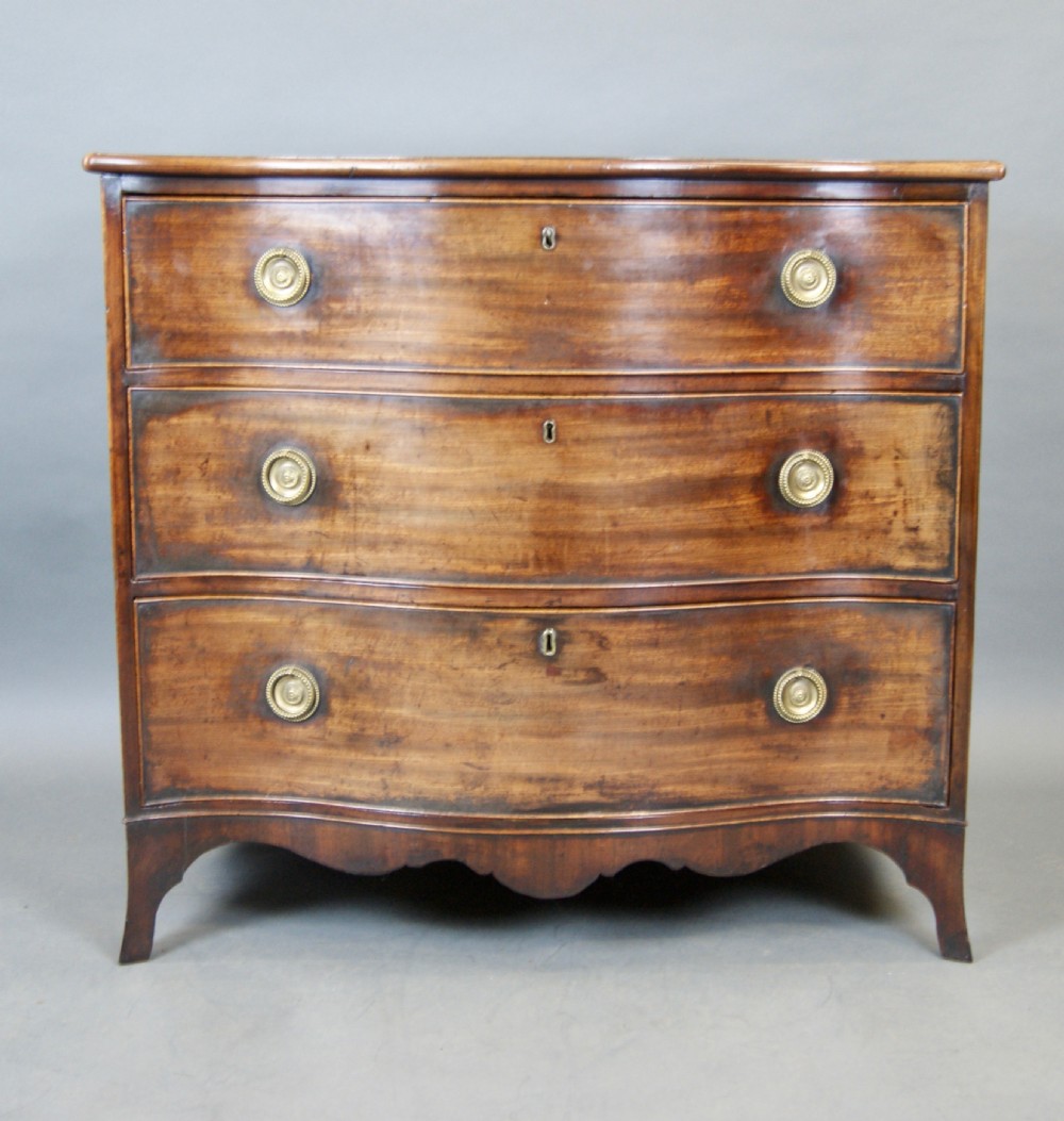 A Hepplewhite Period Mahogany Serpentine Chest  View II