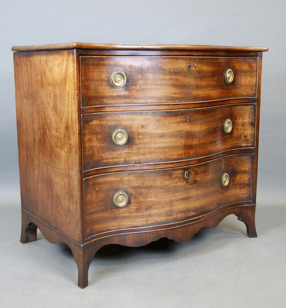 A Hepplewhite Period Mahogany Serpentine Chest  View V