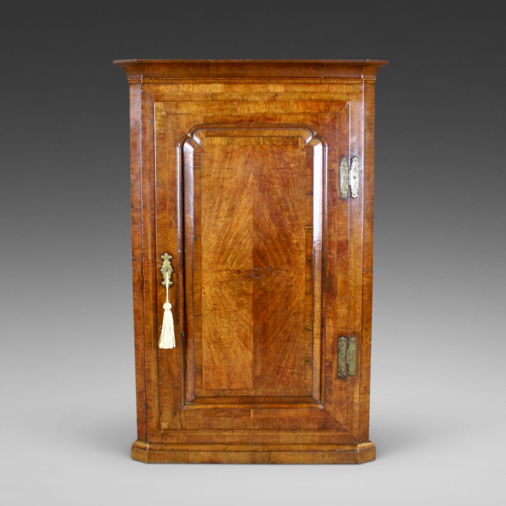 A George II Walnut Corner Cupboard