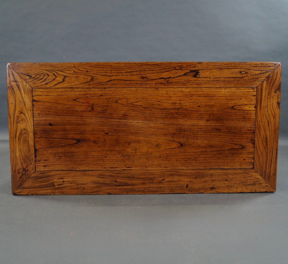 A pair of 19th-century Chinese elm side tables featuring rectangular floating panel tops, carved corner spandrels, and tall straight legs. View III
