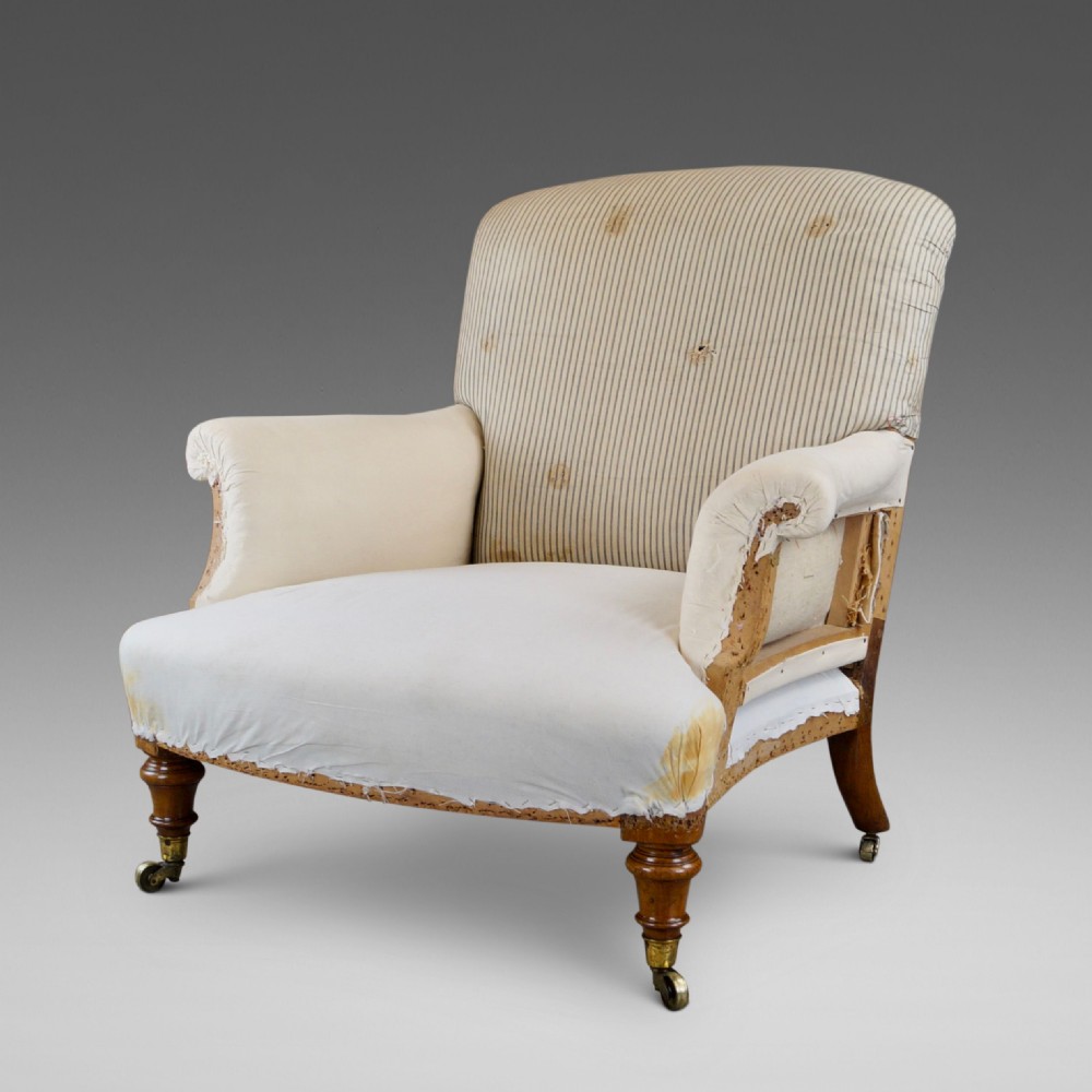 A Fine Walnut Arm Chair by Howard & Sons