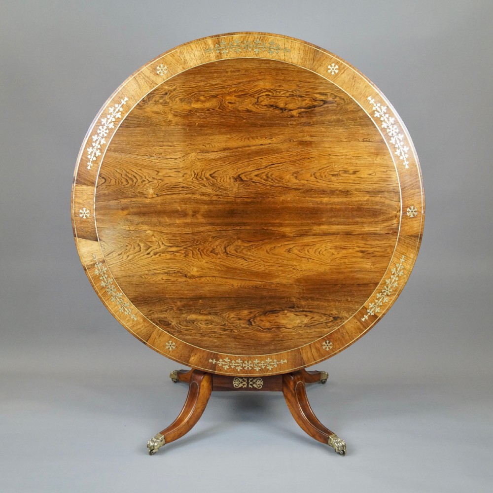 A very attractive Regency rosewood & brass inlaid centre table. 