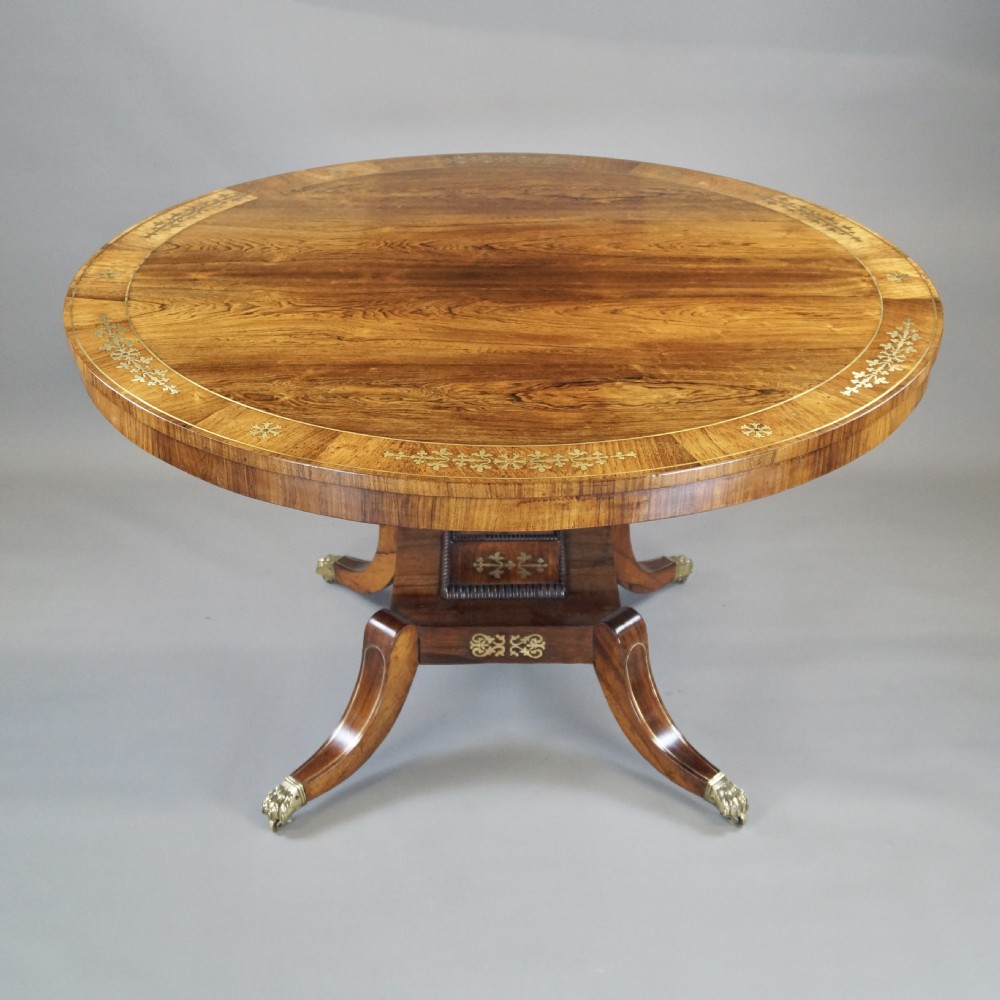A very attractive Regency rosewood & brass inlaid centre table.  View II