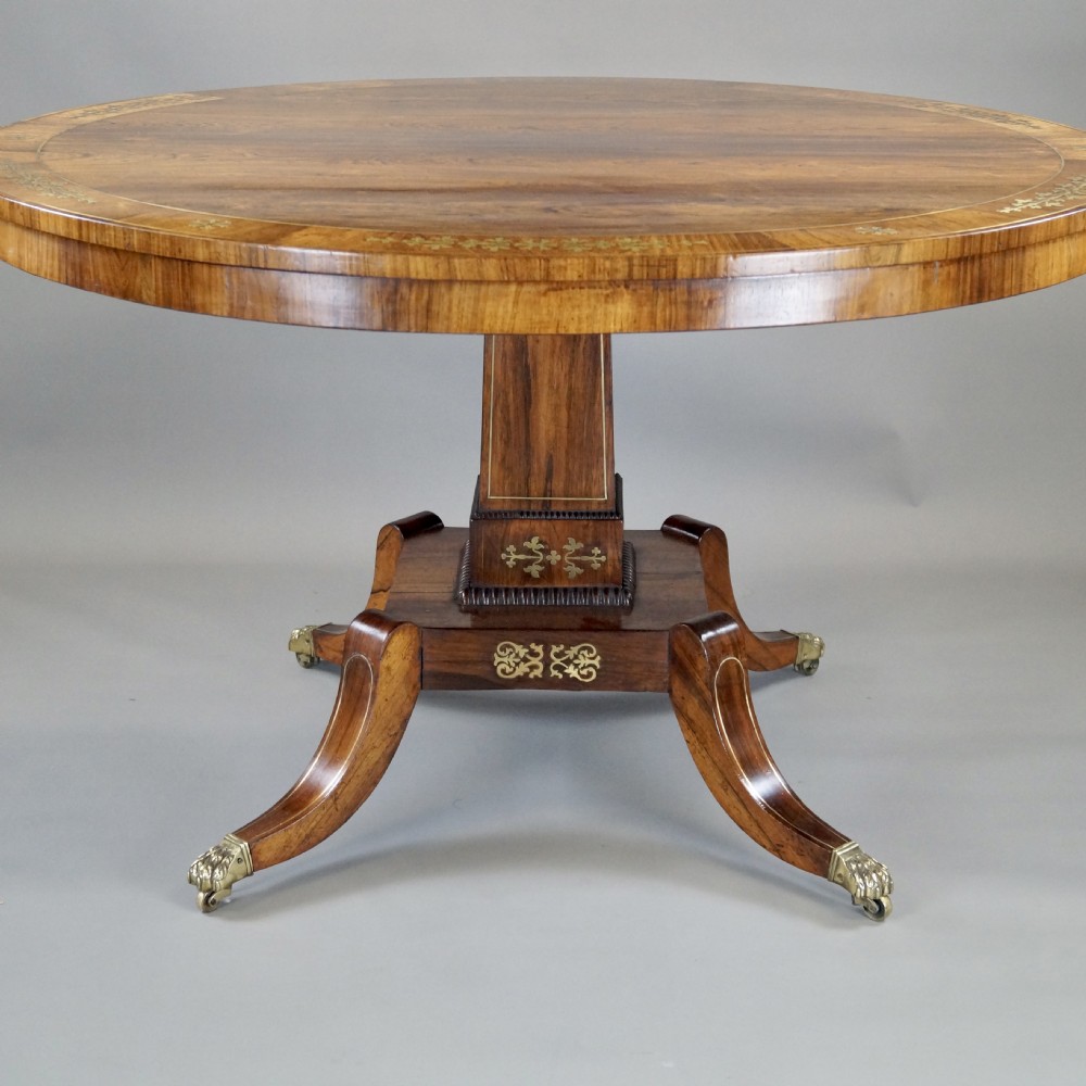 A very attractive Regency rosewood & brass inlaid centre table.  View IV