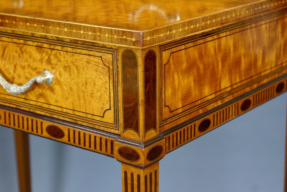 A satinwood bonheur du jour writing desk featuring oval marquetry medallions, a upper shelf superstructure, small drawers, and square tapered legs. View VI