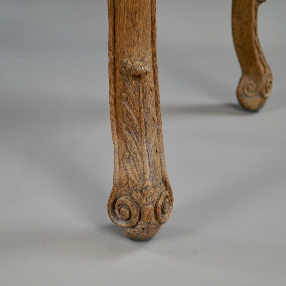 A late 18th-century carved oak console table with cabriole legs, a floral frieze, a shell motif, and a grey-veined white marble top. View VIII