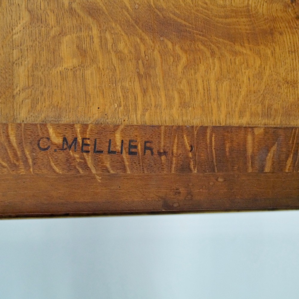 A mahogany writing desk featuring three frieze drawers with brass mounts, a leather-inlaid top, and four tapered fluted legs tipped with brass feet. View VIII