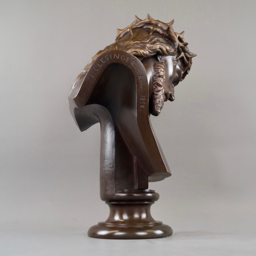 A large dark patinated bronze bust depicting Jesus Christ wearing the Crown of Thorns, mounted on a turned pedestal. View VI