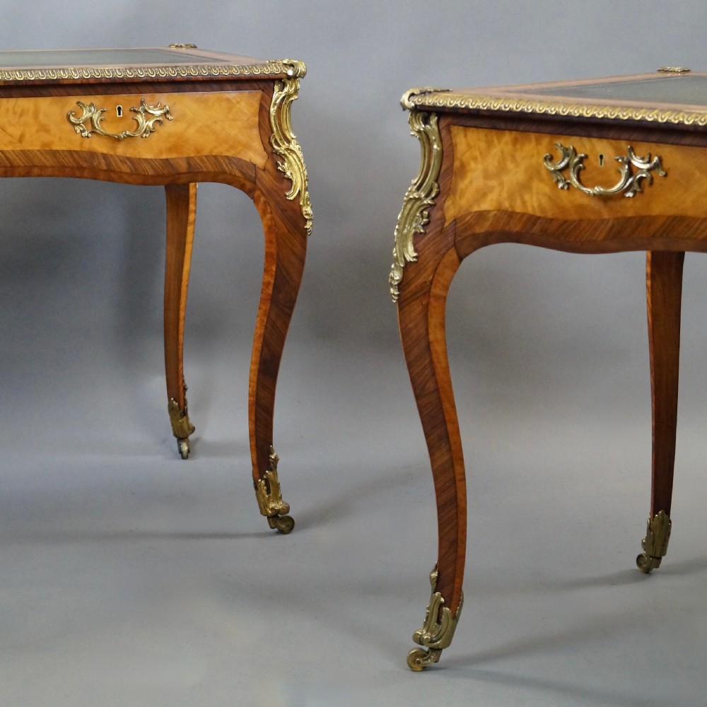 A pair of Louis XV style bureau plat writing desks featuring satinwood marquetry, green leather tops, cabriole legs, and elaborate gilt-bronze mounts. View III