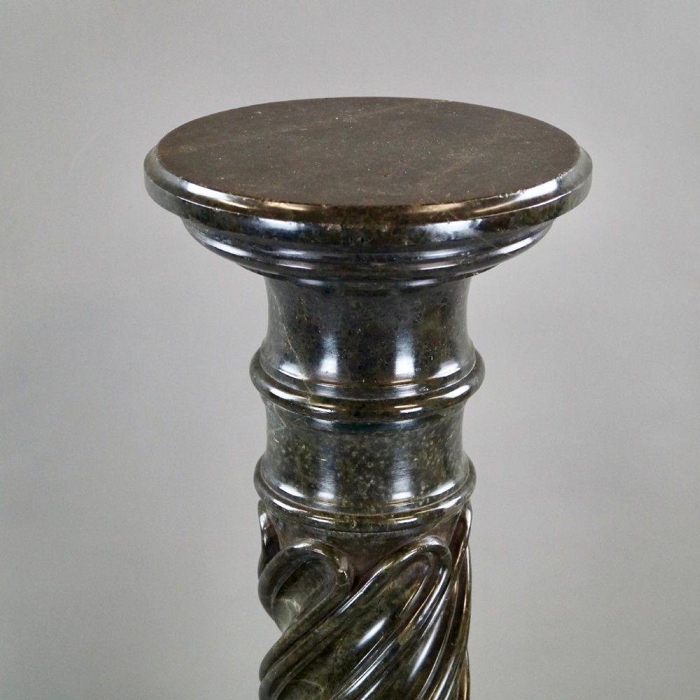 A mid-nineteenth-century French dark green Verde Antico marble column with a carved barley twist shaft and octagonal base. View II