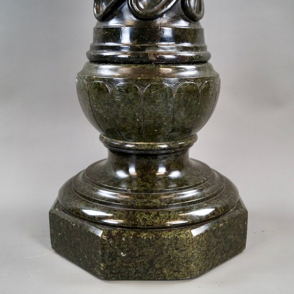 A mid-nineteenth-century French dark green Verde Antico marble column with a carved barley twist shaft and octagonal base. View IV