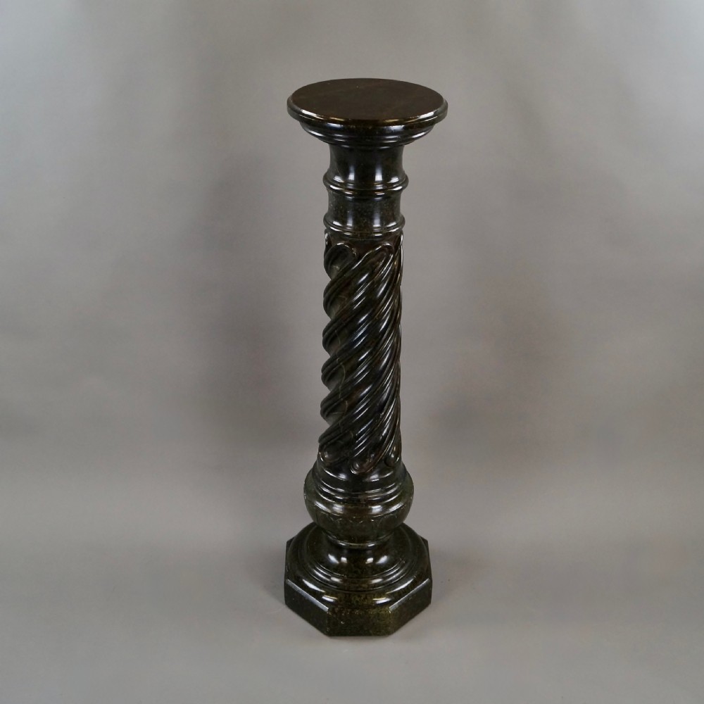A mid-nineteenth-century French dark green Verde Antico marble column with a carved barley twist shaft and octagonal base. View V