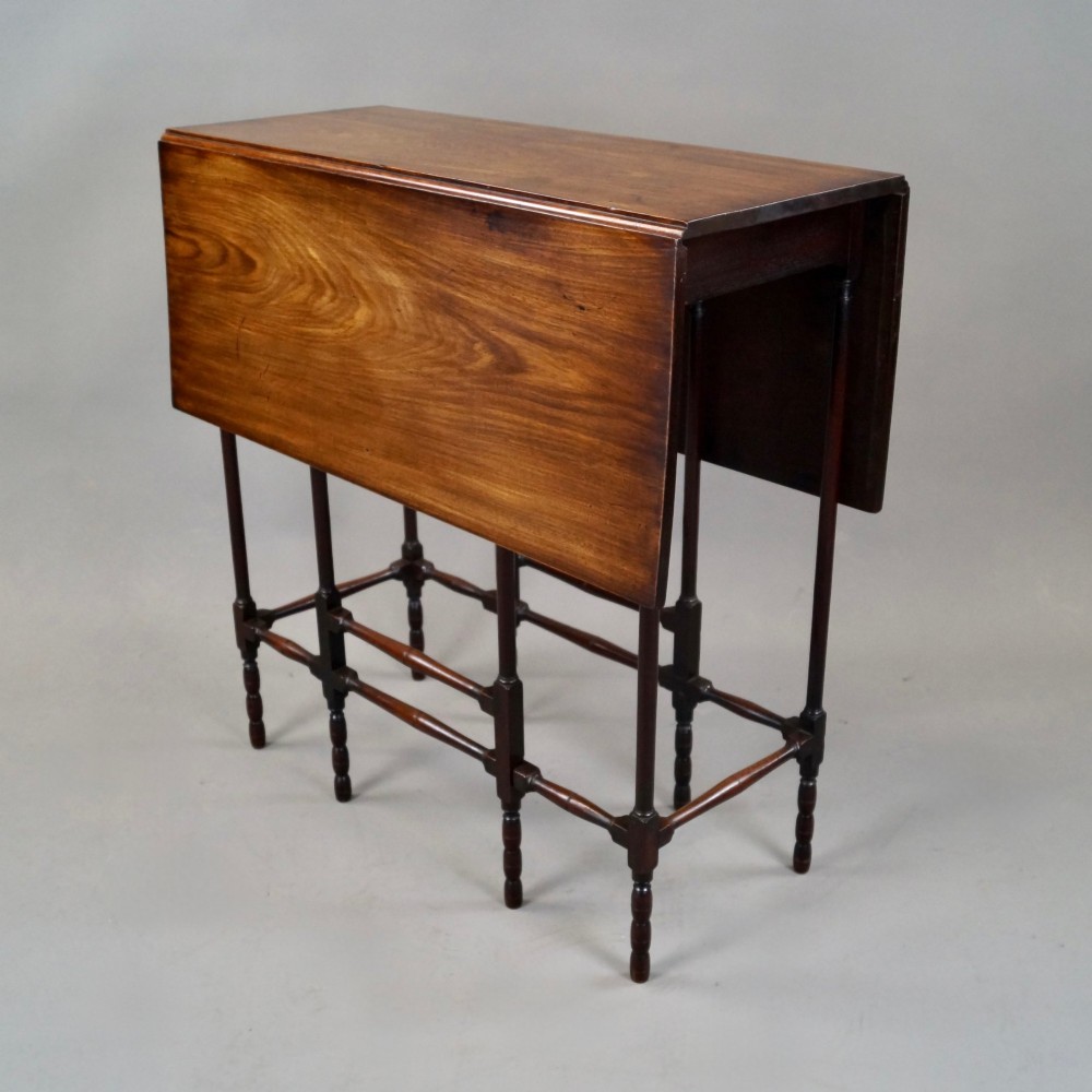 An 18th-century Georgian mahogany spider leg table with two drop leaves supported by slender turned wooden gate legs. View II