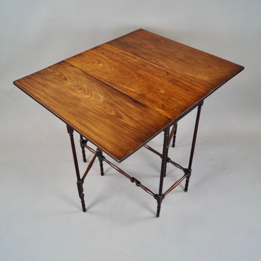 An 18th-century Georgian mahogany spider leg table with two drop leaves supported by slender turned wooden gate legs. View III