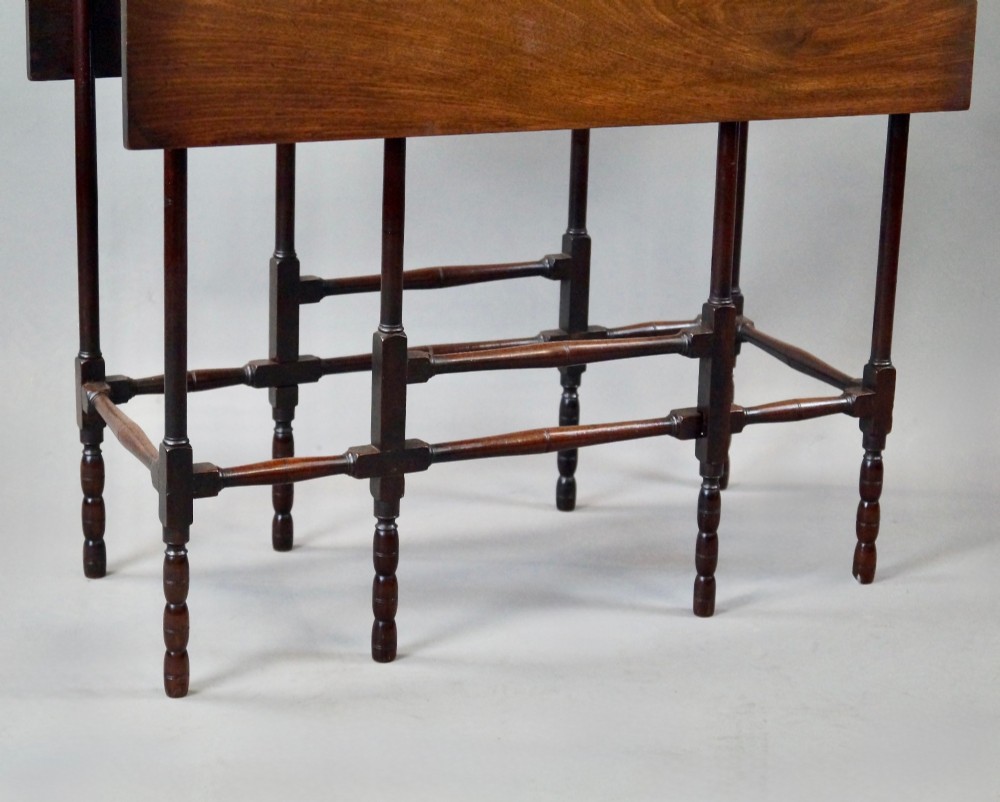 An 18th-century Georgian mahogany spider leg table with two drop leaves supported by slender turned wooden gate legs. View IV