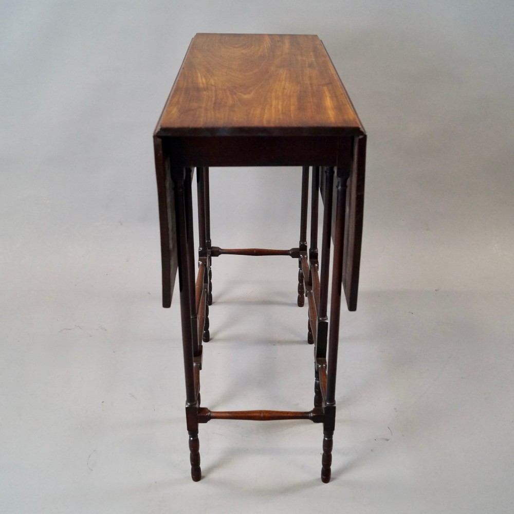 An 18th-century Georgian mahogany spider leg table with two drop leaves supported by slender turned wooden gate legs. View VI