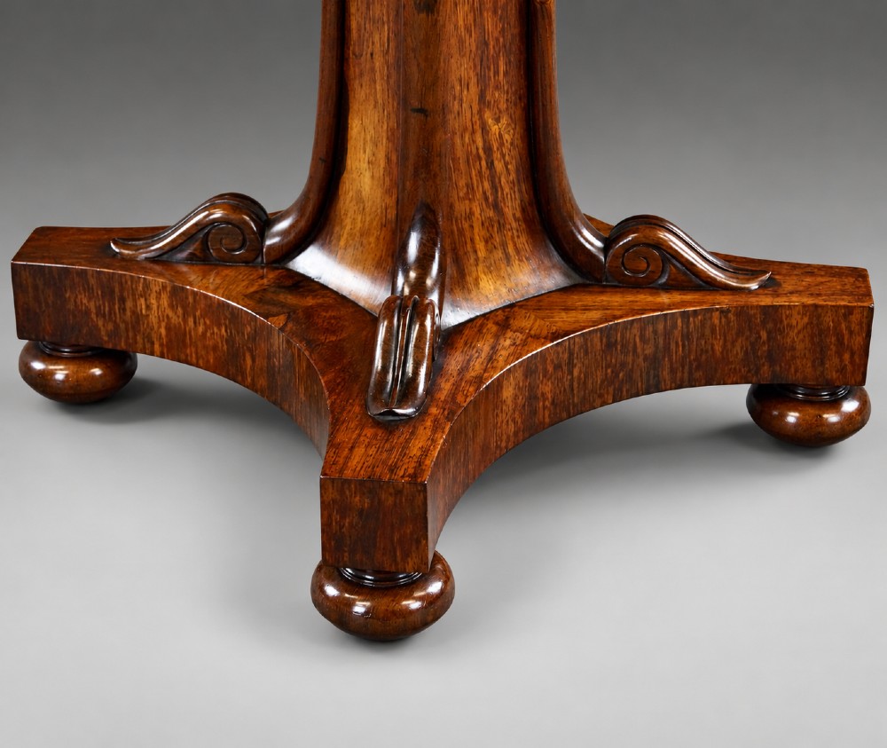 A Regency rosewood chess table featuring a square white and black marble inlaid chessboard top with a Greek key border set upon a flared central pedestal and quadripartite base. View III