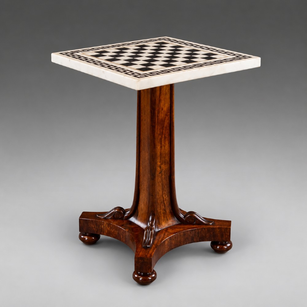 A Regency rosewood chess table featuring a square white and black marble inlaid chessboard top with a Greek key border set upon a flared central pedestal and quadripartite base. View IV