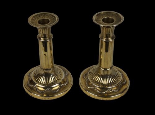 a pair of hallmarked 18th century english sterling silvergilt neoclassical candlesticks