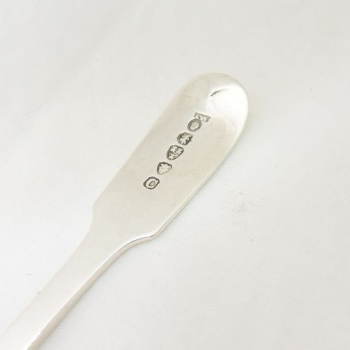 An early Victorian sterling silver sugar shovel with a shaped rectangular shovel bowl and an engraved monogram on the flat handle. View III