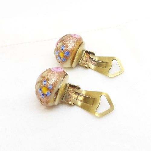 fig 1. A pair of circular Italian wedding cake glass clip-on earrings featuring cream bases adorned with gold aventurine swirls and applied pink glass roses.