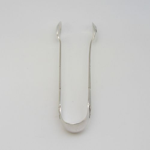 A pair of Victorian sterling silver sugar tongs in the Albany pattern with spoon-shaped ends and visible hallmarks. View II