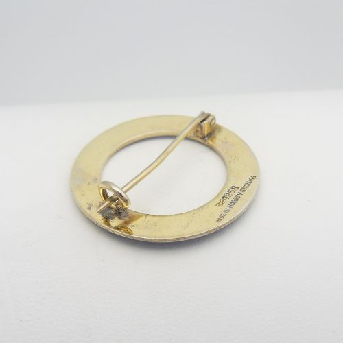 A circular Norwegian brooch crafted in silver with vibrant cobalt blue guilloche enamel and fine geometric line patterns. View IV