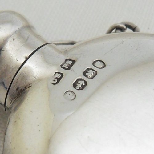 fig 1. A round Victorian sterling silver miniature scent flask with a suspension chain and stamped hallmarks.
