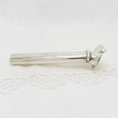 An Edwardian sterling silver cylindrical posy holder featuring a flared rim and a small attachment loop. View III