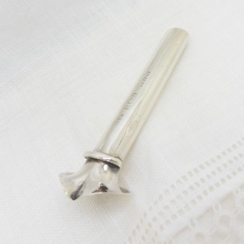 An Edwardian sterling silver cylindrical posy holder featuring a flared rim and a small attachment loop. View IV