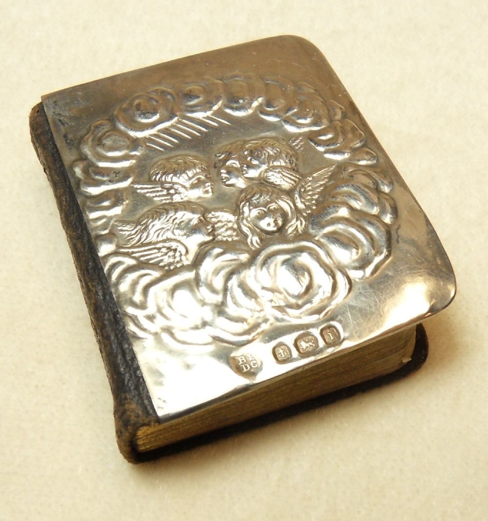 EDWARDIAN SILVER FRONT PRAYER BOOK DECORATED WITH REYNOLDS ANGELS HALLMARKED BIRMINGHAM 1908