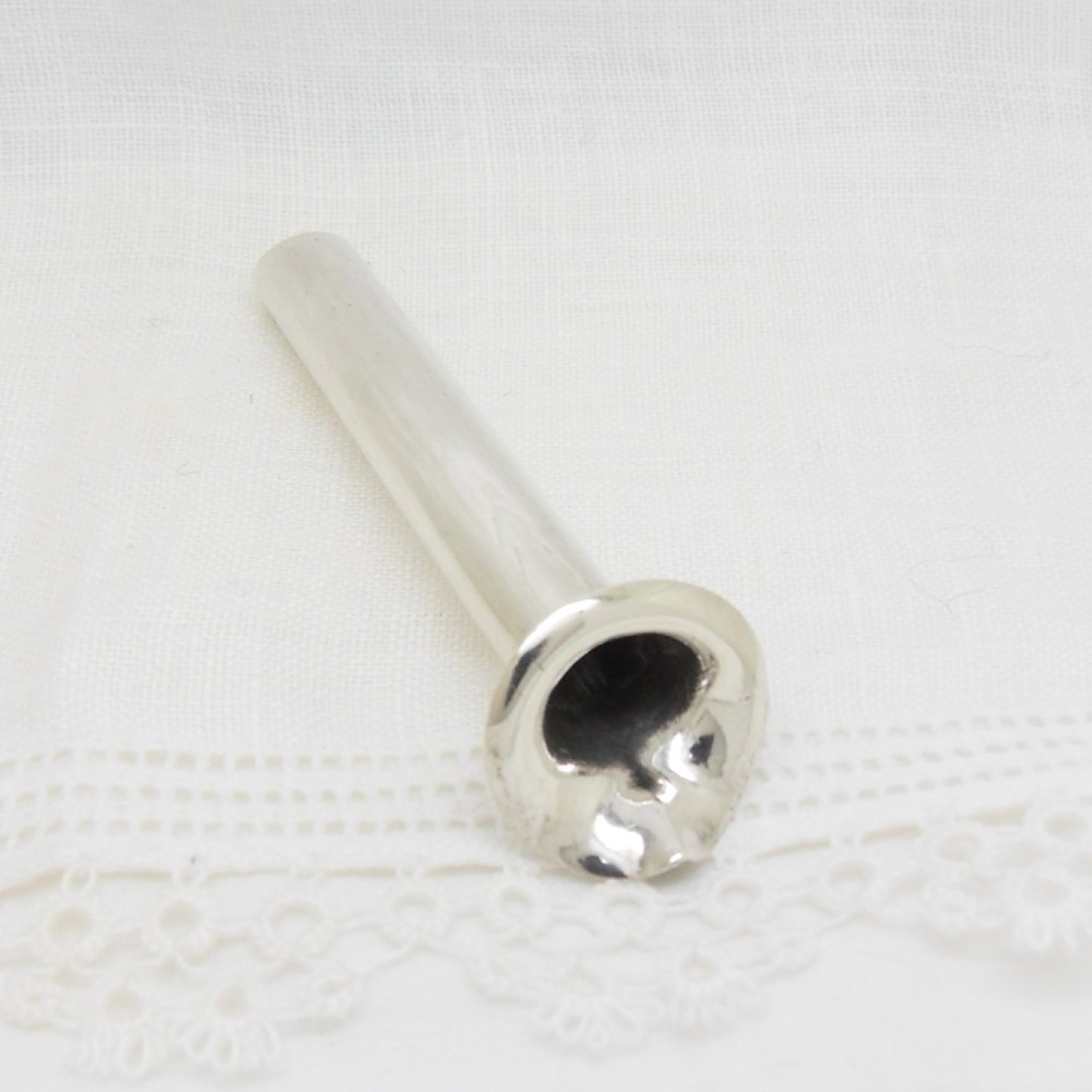 An Edwardian sterling silver cylindrical posy holder featuring a flared rim and a small attachment loop. View VI