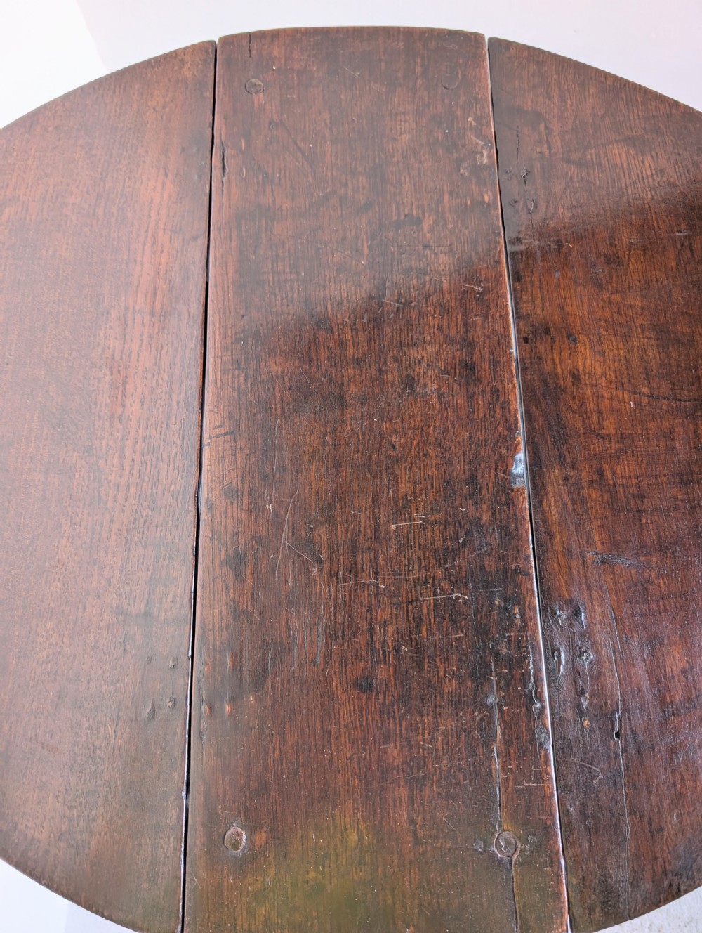 A small dark oak gateleg table featuring a drop-leaf top, barley twist legs, and lower connecting stretchers. View II