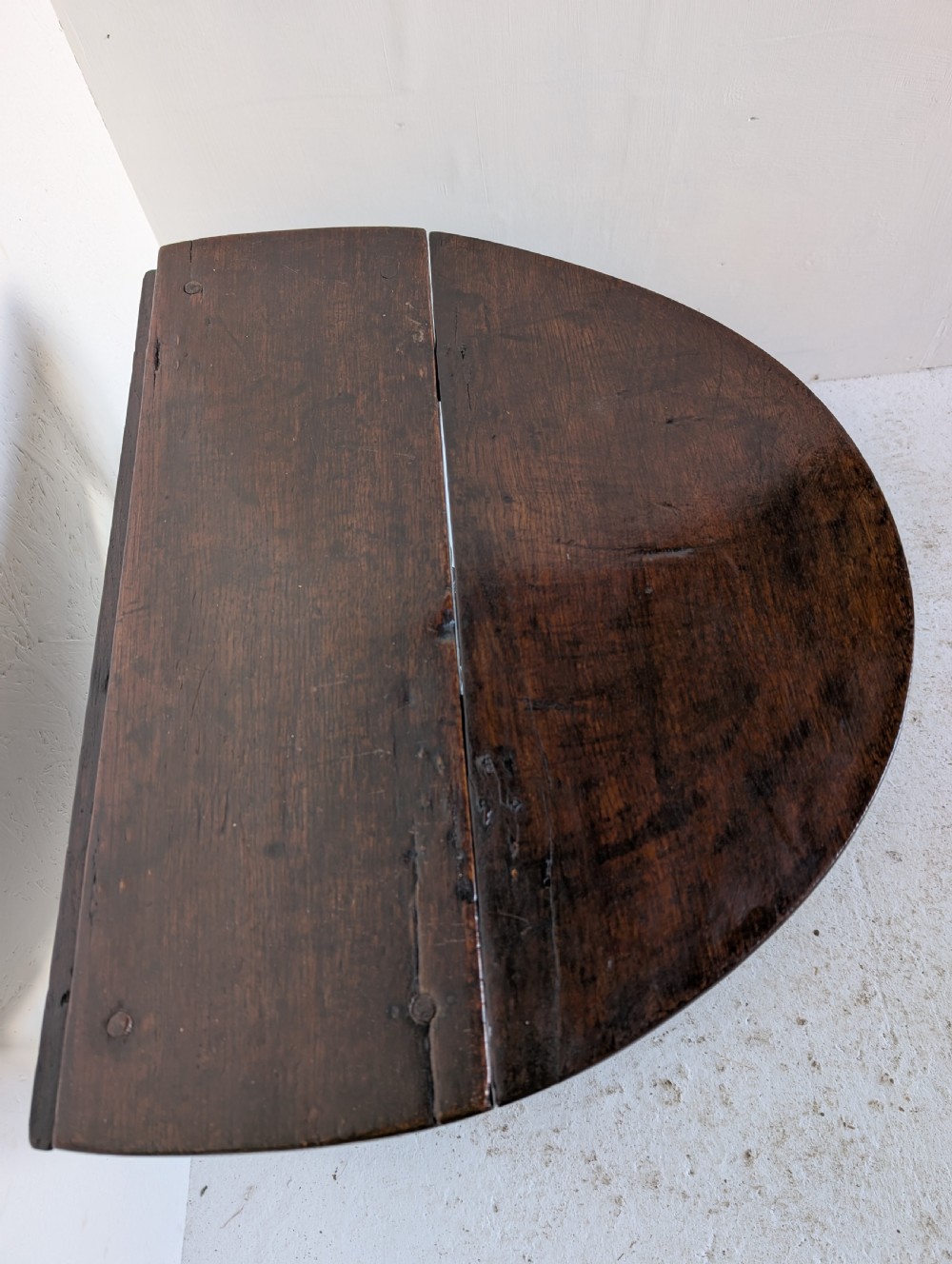 A small dark oak gateleg table featuring a drop-leaf top, barley twist legs, and lower connecting stretchers. View IX