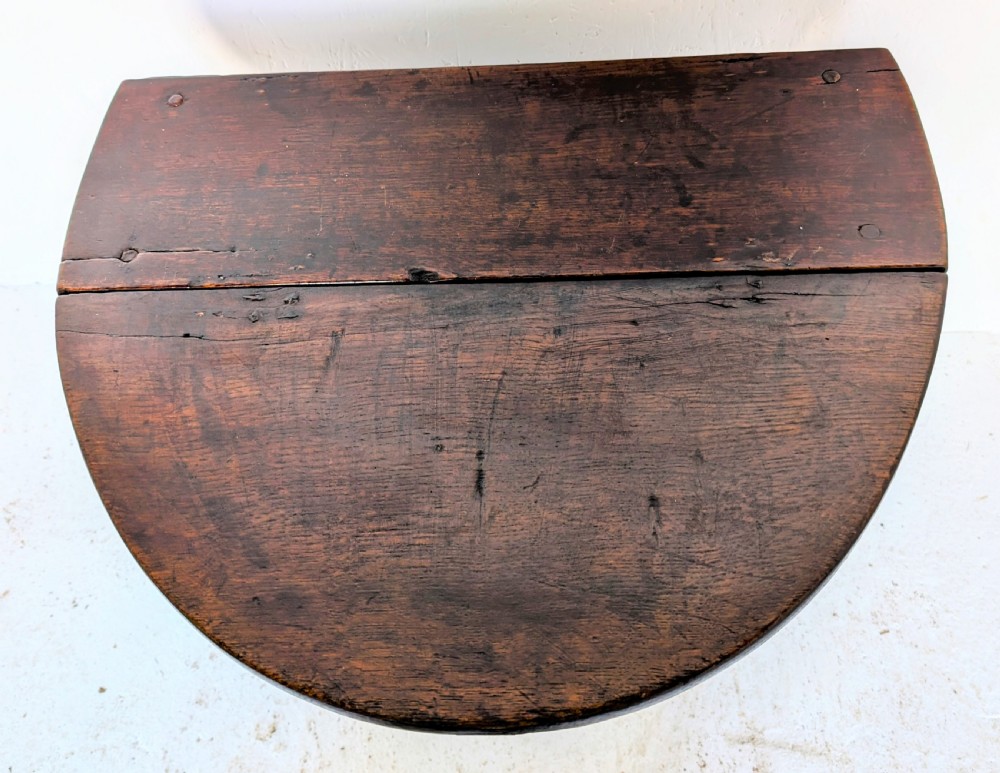 A small dark oak gateleg table featuring a drop-leaf top, barley twist legs, and lower connecting stretchers. View XII