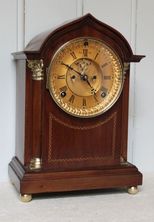 fig 1. mahogany and inlay visible escapement mantel clock