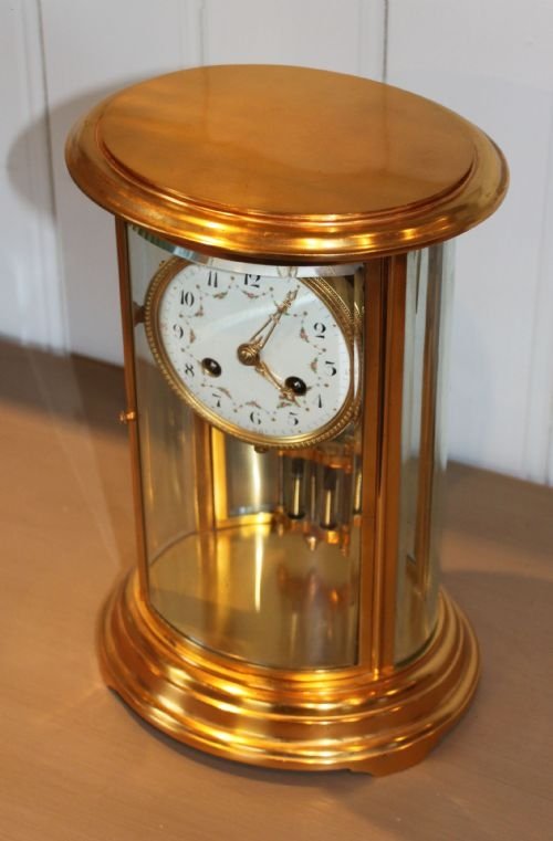 fig 1. oval four glass mantel clock