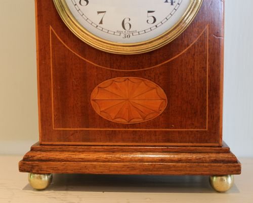 fig 1. Mahogany and inlaid lancet top mantel clock