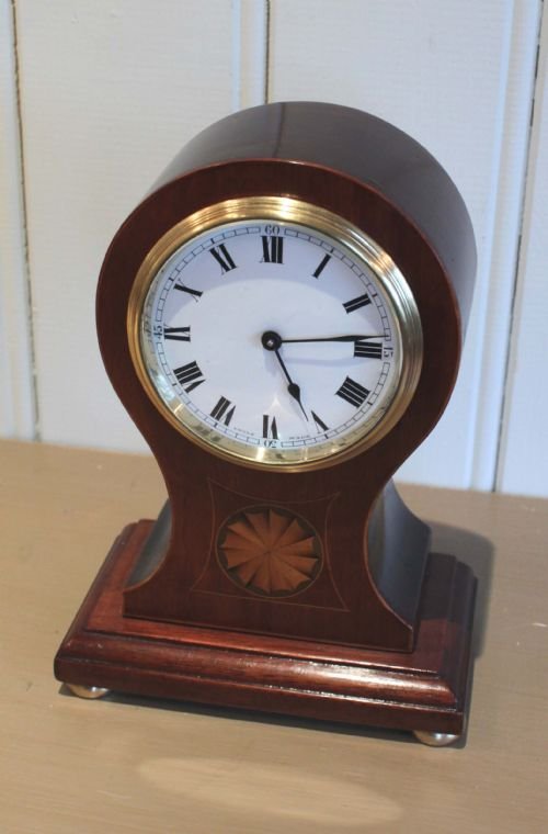 fig 1. Mahogany and Inlaid Balloon Clock