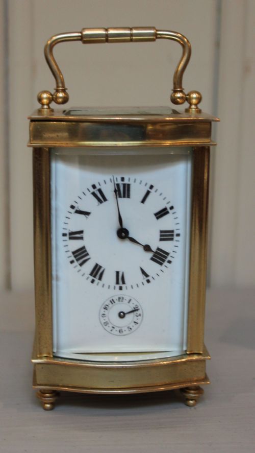 fig 1. Serpentine Alarm Carriage Clock in a Winged Travel Case 
