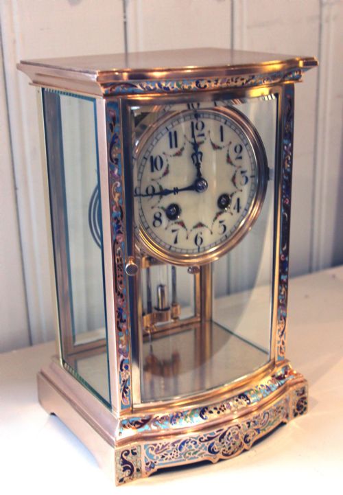 fig 1. Bow Fronted Champleve Enamel Four Glass Clock