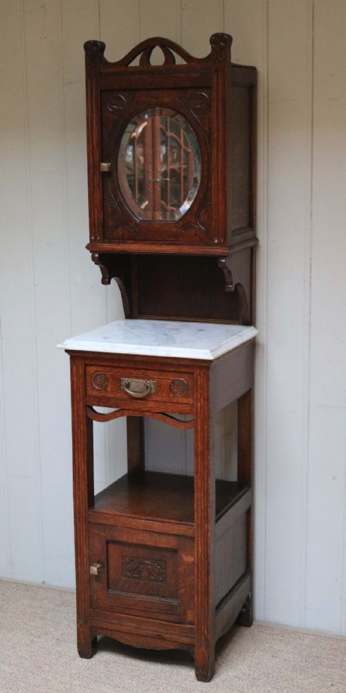 fig 1. Oak Cabinet With Mirrored Cupboard Top