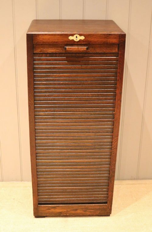fig 1. Dark Oak Tambour Front Filing Cabinet